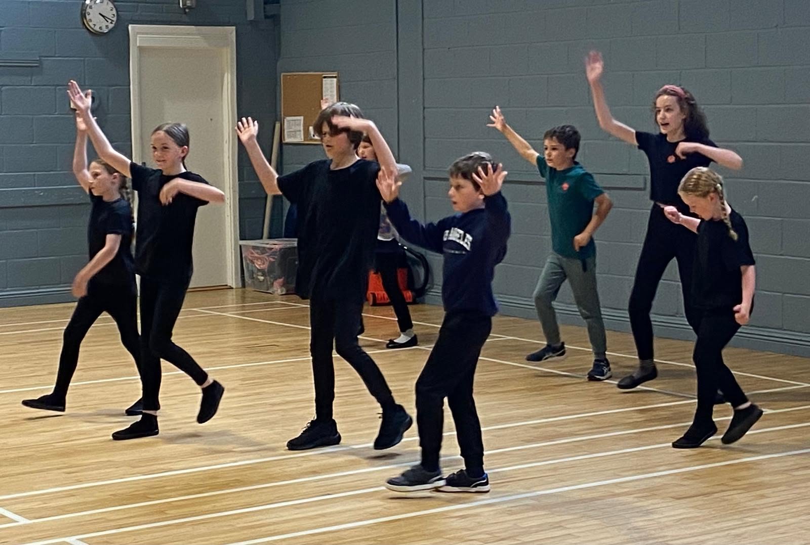 Students rehearsing choreography in the studio